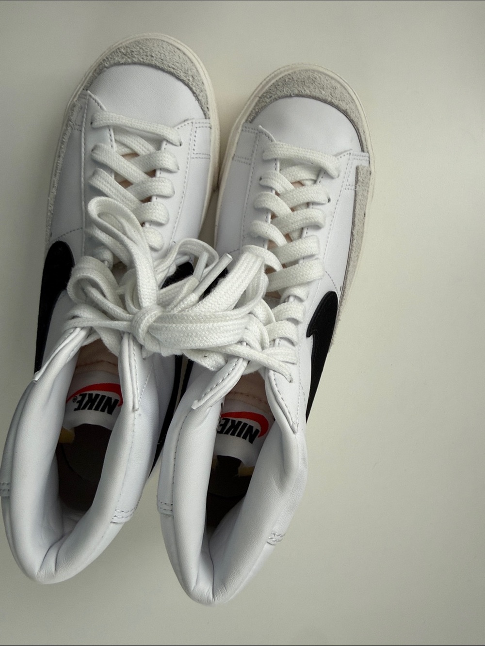 Nike White High-Top Sneakers with Black Swoosh